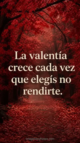 Sendero entre árboles de hojas rojas con una frase motivadora sobre la valentía de no rendirse